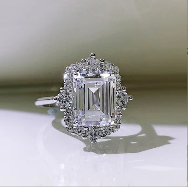 Elegant Emerald Cut Cluster Arielle Halo Engagement Ring in Sterling Silver