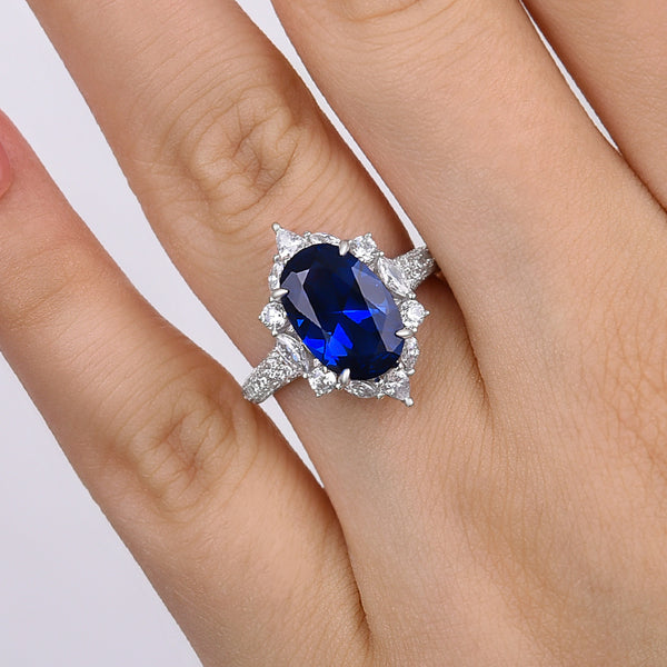 Attractive Blue Sapphire Oval Cut Halo Engagement Ring in Sterling Silver