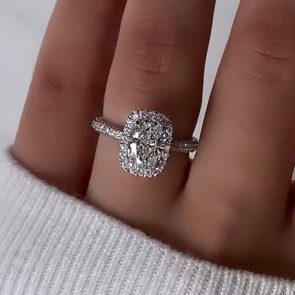 Exclusive Oval Cut Simulated Diamond Halo Engagement Ring in Sterling Silver